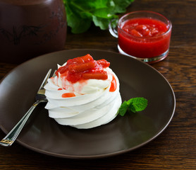 Dessert of meringue with rhubarb and mint sauce.