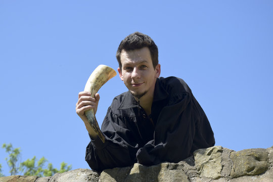young handsome man at the castle wall 