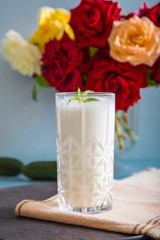 Obraz na płótnie Canvas Ayran - liquid drink made from yogurt in ransparent glass cup
