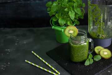 Healthy green smoothie with spinach, kiwi, banana and chia