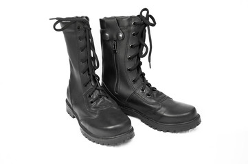 military boots black on the lock and with rivets, sole with a pattern, legs for protection of legs