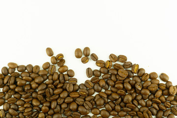 close up of medium or dark roasted coffee beans isolated on white background, can be used as a background or graphic object in your ads.