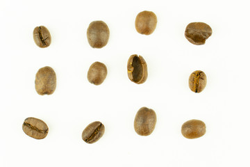 Fototapeta na wymiar close up of medium or dark roasted coffee beans isolated on white background, can be used as a background or graphic object in your ads.