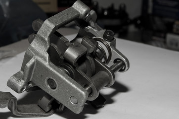 detail for the repair of a machine, a product made of metal, a spare part on a white background,