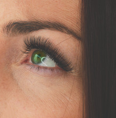 Obraz premium Woman green eyes with Long Eyelashes