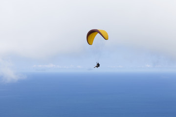 Paraglider flying over Sao Conrado in Rio de Janeiro.