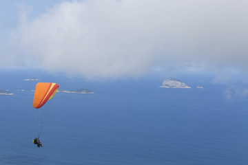 Paraglider flying over Sao Conrado in Rio de Janeiro.