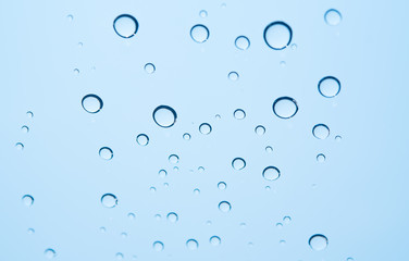 Water droplets on the glass as a backdrop.