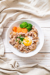 donburi, pork rice bowl with onsen egg and vegetable