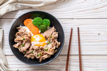 donburi, pork rice bowl with onsen egg and vegetable