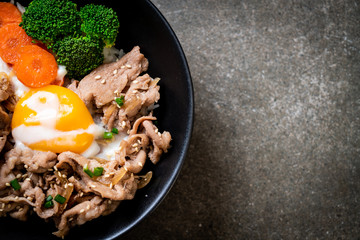 donburi, pork rice bowl with onsen egg and vegetable