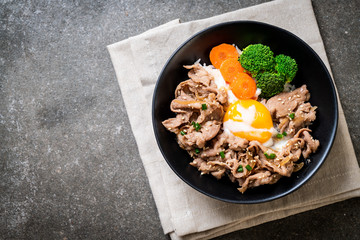 donburi, pork rice bowl with onsen egg and vegetable