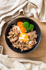 donburi, pork rice bowl with onsen egg and vegetable