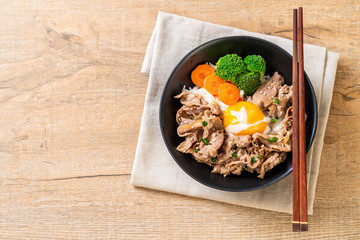 donburi, pork rice bowl with onsen egg and vegetable