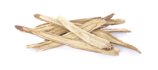 Slice liquorice root on white background