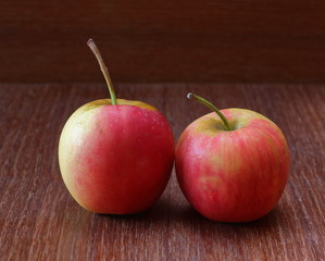 Fresh Juicy red apples on old wooden