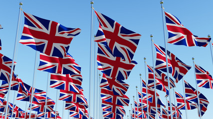Fototapeta na wymiar Many flags of the United Kingdom waving in blue sky. Three dimensional rendering 3D illustration. 