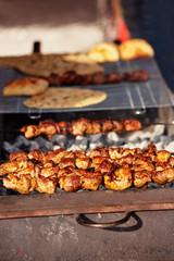 Closeup of tasty meat cooked at barbecue on winter day
