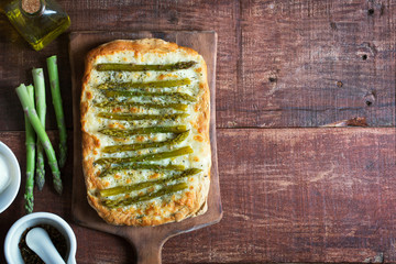 Asparagus green pizza with herbs and mozzarella