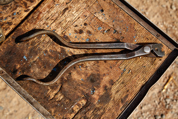 Horseshoes horse tools on a grunge wood