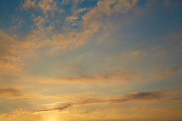 Naklejka na ściany i meble Sunset sky orange clouds on blue sky