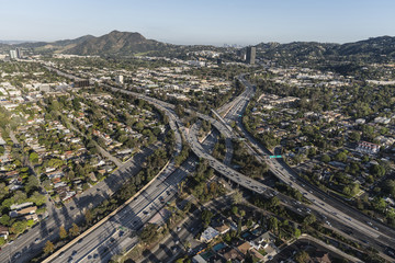 Fototapeta na wymiar Aerial view of Ventura 101 Freeway and Hollywood 170 freeways in the San Fernando Valley area of Los Angeles, California.