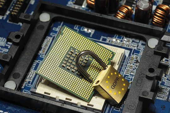 concept of data security protection. cpu computer processor over motherboard and padlock over.