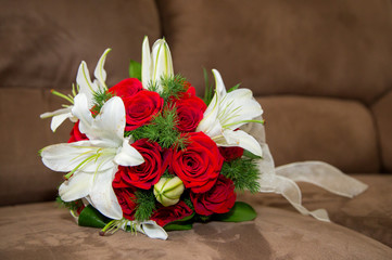 white flowwers and red roses wedding bouquet