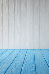 blue striped tabletop and white wooden wall