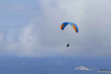 Paraglider flying over Sao Conrado in Rio de Janeiro.