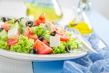 Fresh Greek salad with cherry tomatoes, lettuce and feta cheese