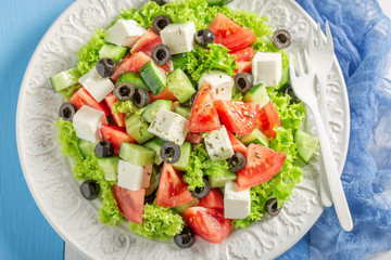 Diet Greek salad with black olives, feta cheese and lettuce
