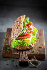 Delicious sandwich with ham, cheese and tomato for breakfast