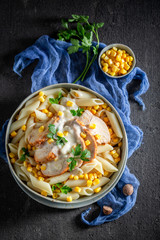 Yummy penne with bechamel sauce, chicken and corn