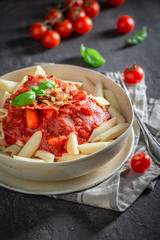 Hot penne bolognese made of fresh tomatoes