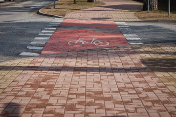 Bicycle sign on asphalt .