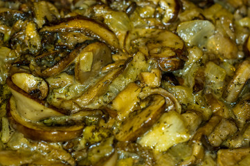 fried with onions and spices Royal mushrooms champignons in a frying pan