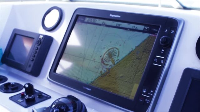 View of an echo sounder on board a marine vessel. Stock. Echo sounding is a type of sonar used to determine the depth of water by transmitting sound pulses into water