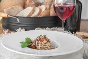 Close up low angle view of a plate of spaghetti topped with delicious bolognaise sauce