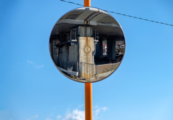 Glass reflection rounded signal traffic on blue sky
