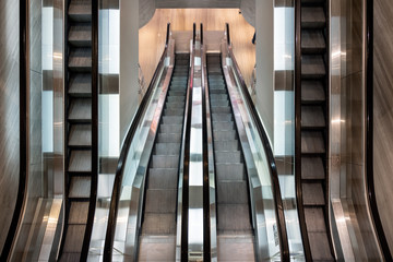 Modern escalator parallel moving in department store