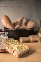 Different kinds of bread rolls on table wooden from above. Kitchen or bakery poster design