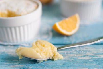 Homemade lemon puddings with lemon zest and juice
