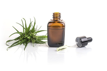 cannabis essential oil container with cannabis leaves
