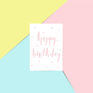 Happy birthday - brush lettering card on a pink, blue and yellow