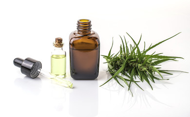 cannabis essential oil container with cannabis leaves