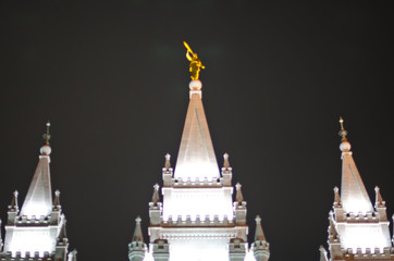 Golden Moroni in the night sky on top of the salt lake city temple. 