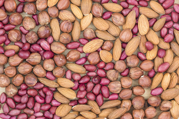 various mix nuts background: almonds, hazelnuts, peanuts