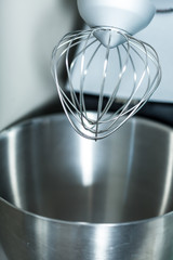 Top of modern mixer with steel whisk