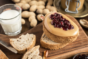 Homemade Healthy Breakfast. Peanut Butter and Jelly on Dark Wooden Background.